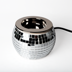Detail of chrome finish and roller switch cord of Disco Ball Wax Warmer