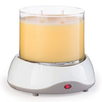 Close‑up of warming plate on Original Warmer with Auto Shut‑Off and melting candle