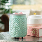 Mint Leaf Flip Dish Wax Warmer melting wax cubes on a countertop for a fresh, clean fragrance